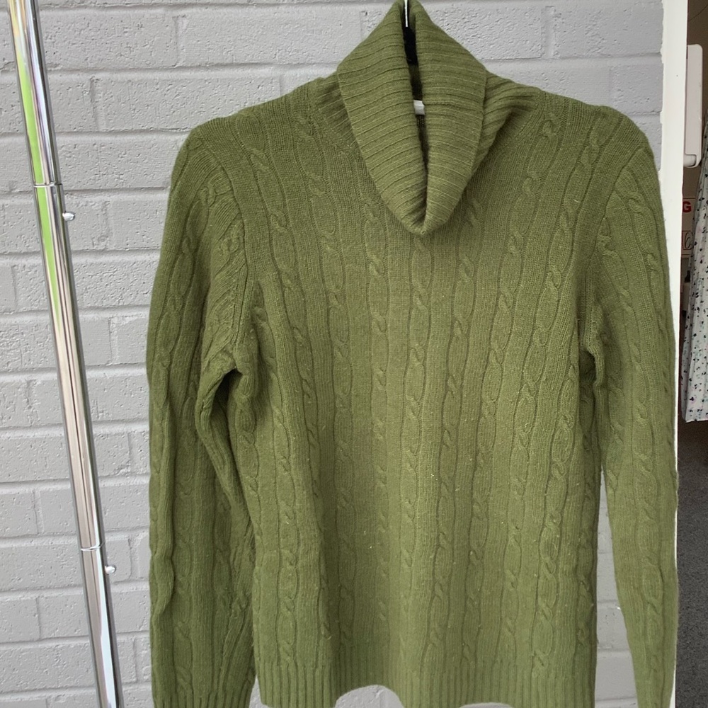 Dark green cableknit turtleneck sweater